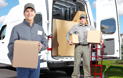 Local packing team preparing items in a Camden flat with tight access