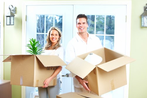 Packed office furniture and equipment ready for Camden relocation