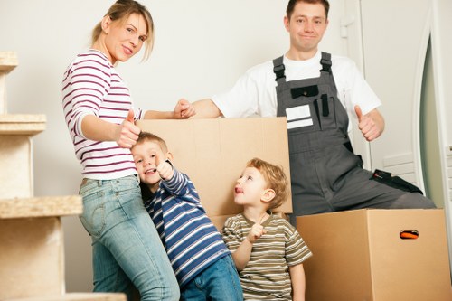Furniture and household items being loaded for transport in Camden